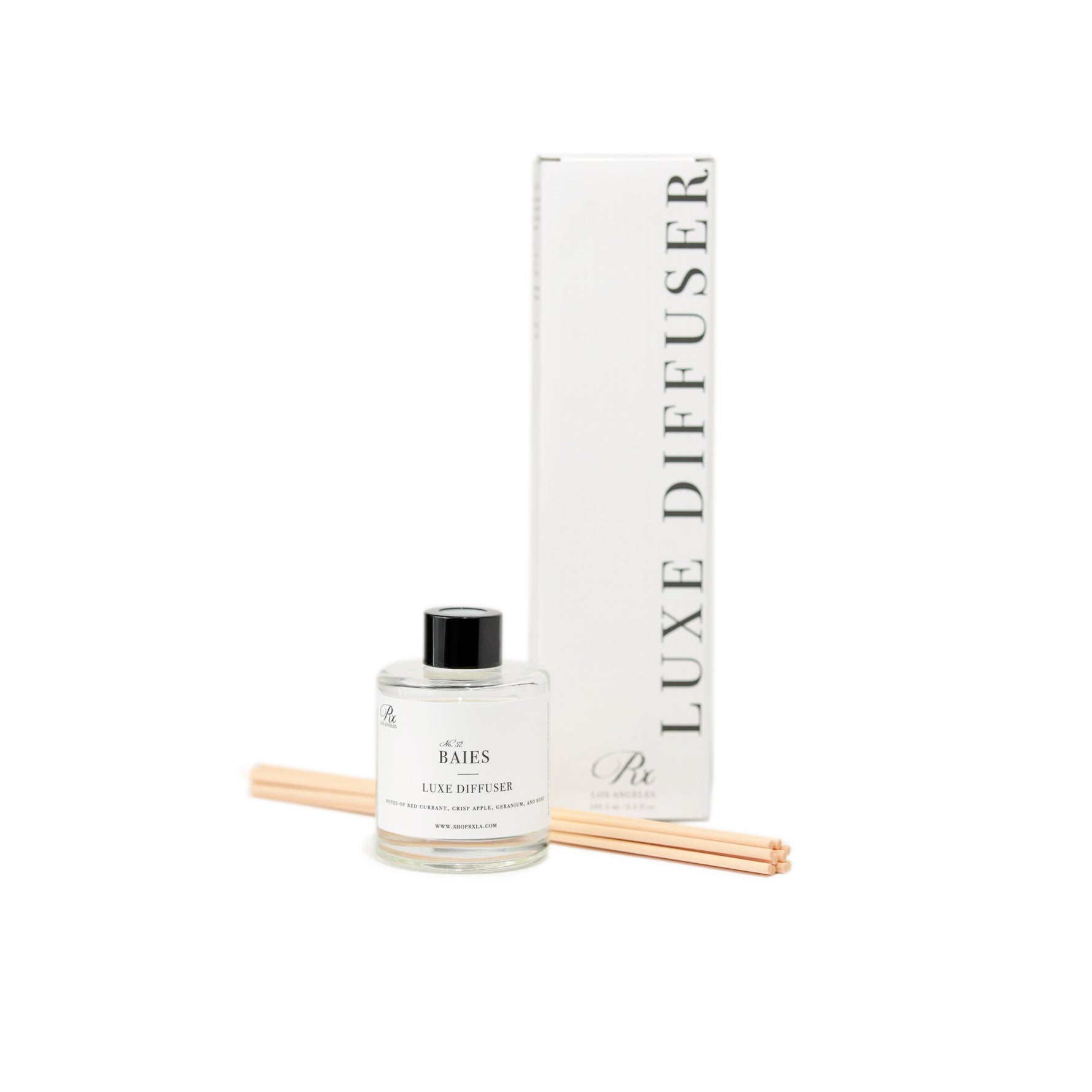 Baies reed diffuser, offering a bright and fresh blend of red currant and rose. A luxurious home fragrance that fills your space with a vibrant and uplifting aroma.