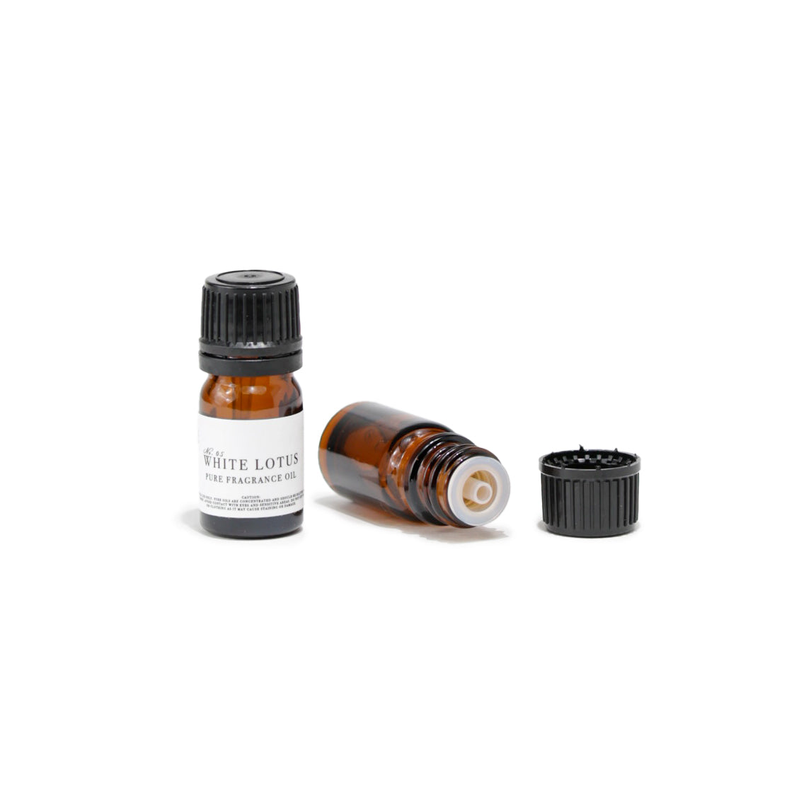 Pure fragrance oil bottle, perfect for use in diffusers, on skin, or for DIY candle and perfume making, offering luxurious scents reminiscent of a tropical vacation or luxury resort.