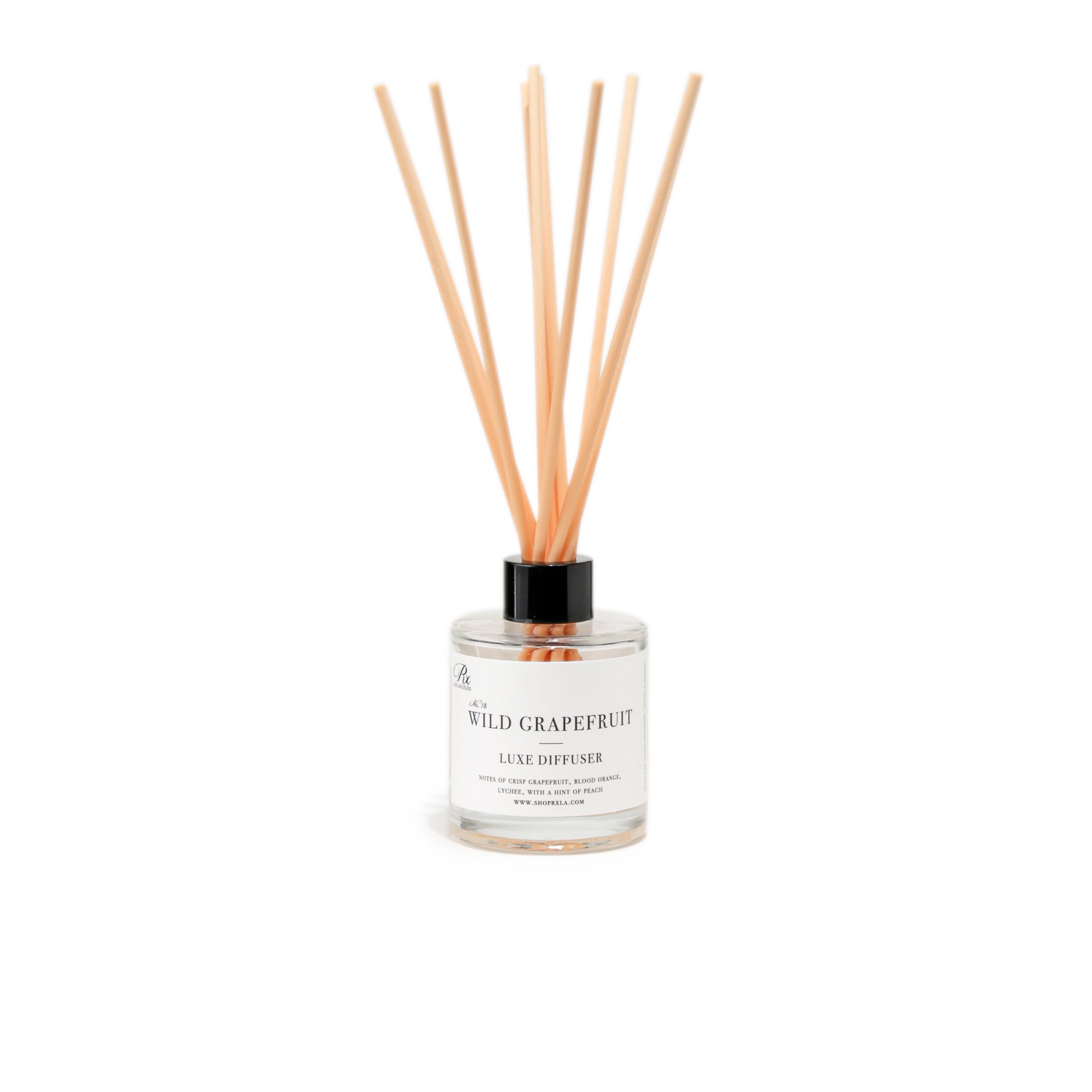 Wild Grapefruit diffuser, featuring a fresh and invigorating fragrance with bright citrus notes of grapefruit, balanced by subtle hints of green leaves and a touch of sweetness, perfect for energizing any room.